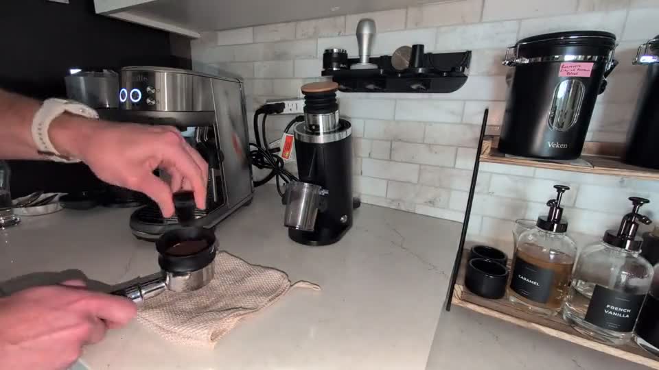 Espresso preparation source frame: distributing coffee grounds